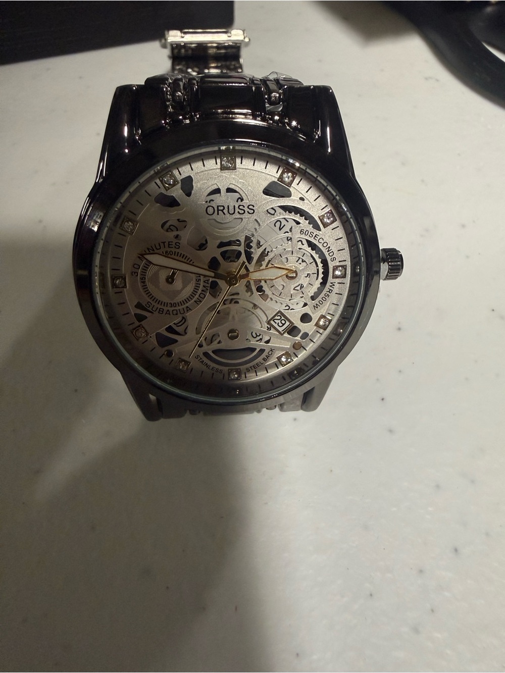 # 106 Oruss Men's Skeleton Dial Watch in Black and Silver